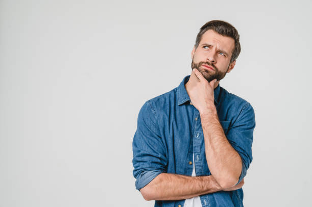 A man pondering and wondering hard